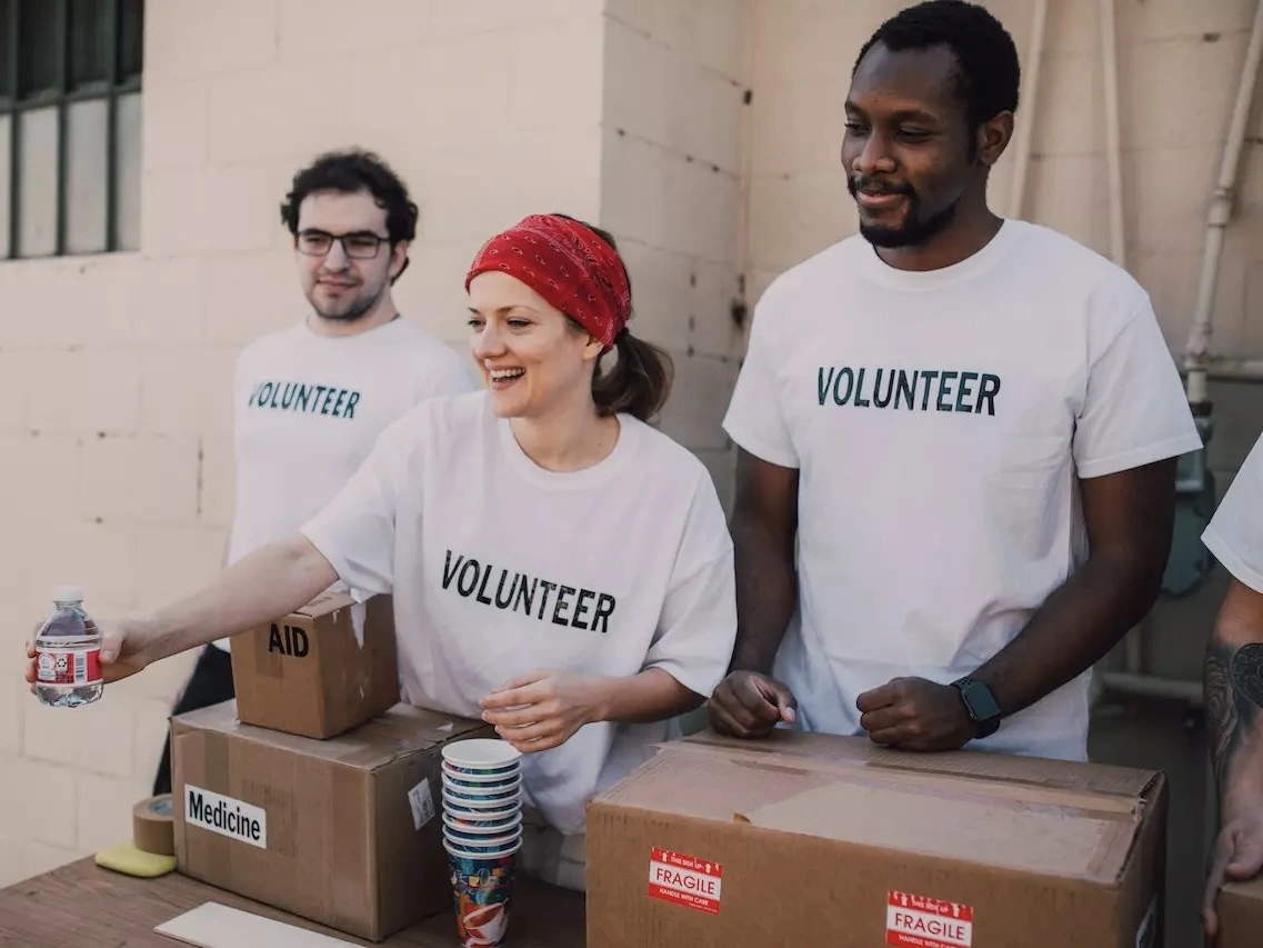 Volunteers handing out bottles of water. 