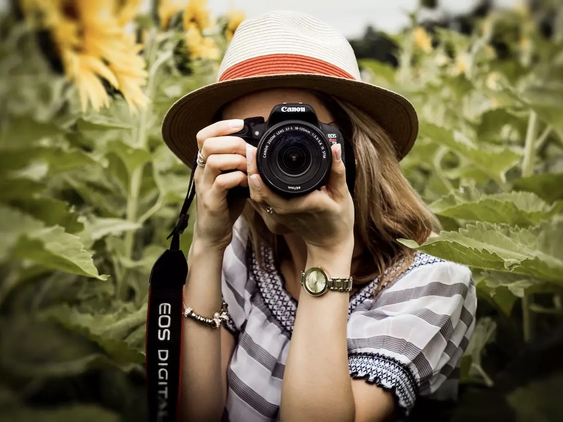 A woman taking a photograph. 