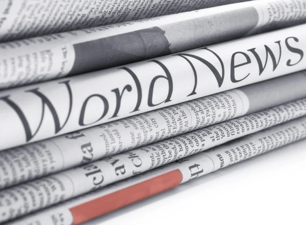 A closeup of a stack of newspapers.